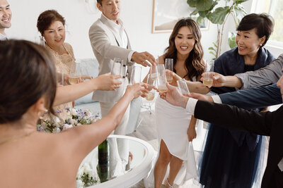 wedding party cheers with champagne