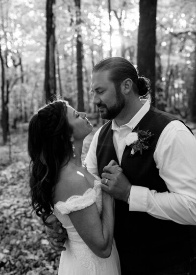 Couple in the woods on their wedding day.