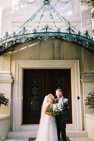 Bride and groom walk up memorial steps at their DC wedding