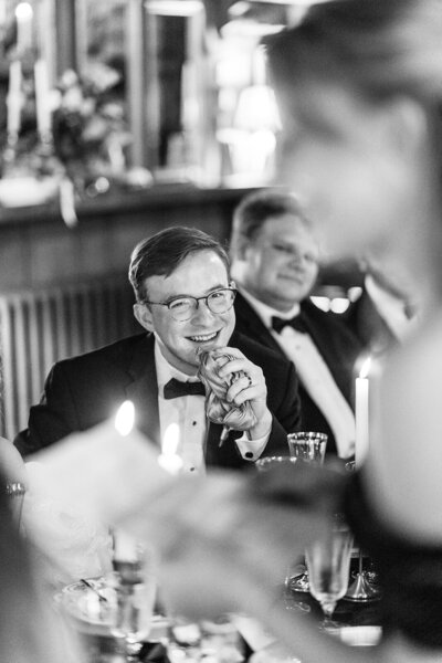 A bride and groom smile at the camera for an asheville wedding photographer