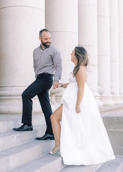 Bride and groom walk up memorial steps at their DC wedding