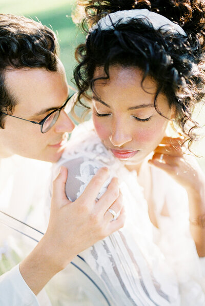 Bride and groom sharing an intimate moment during a romantic outdoor wedding, captured by Toronto wedding photographer Nadtochiy