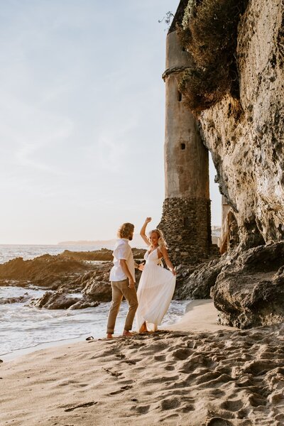 couple dancing during elopement at Victoria Beach Pirate Tower in Laguna Beach CA