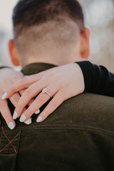 engaged couple embracing