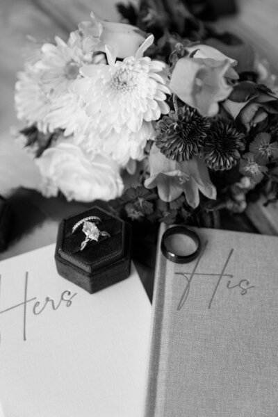 Bride holding up a bouquet of flowers during a beach elopement in Michigan.