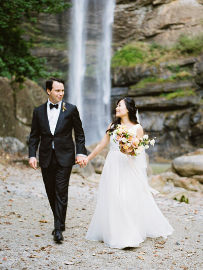 Bride and groom walk up memorial steps at their DC wedding