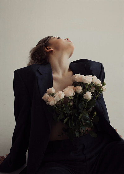 suit and flowers lady