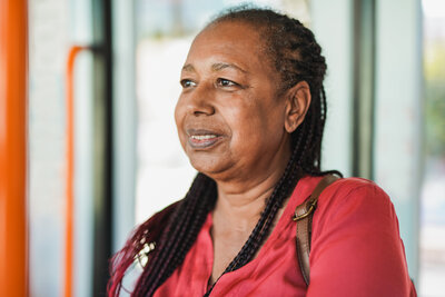 african-senior-woman-inside-tram-transportation-2023-11-27-04-50-03-utc