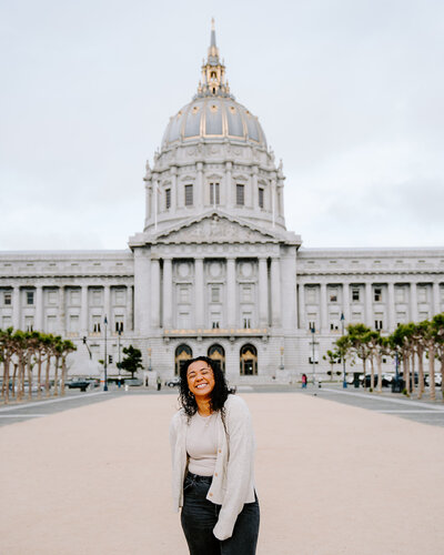 woman in front of city hall building