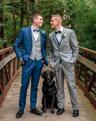 LQBTQ Wedding Photographers two grooms and dog pose for photos