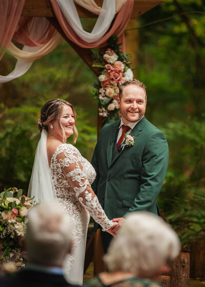 Bride Under crystal chandelier in modern light and airy wedding photography located in Portland oregon PNW photographer