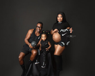 maternity session in hamilton featuring family wearing black nike clothing