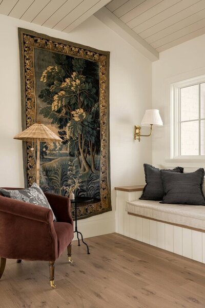 A room featuring a mirror on the wall and a basket placed on the floor, creating a serene and organized atmosphere.