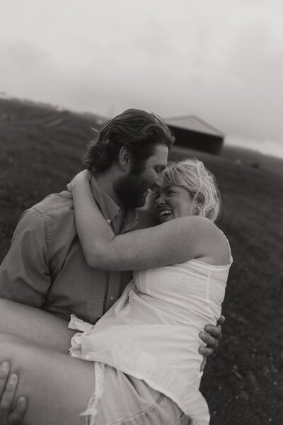 Man holds woman in his arms