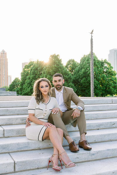 engaged couple sitting on chicago museum stairs