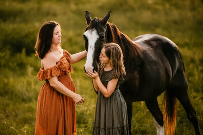 Daughter goes in to smooch her horse.