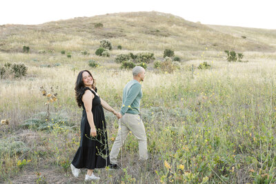 smiling couple photo in open field