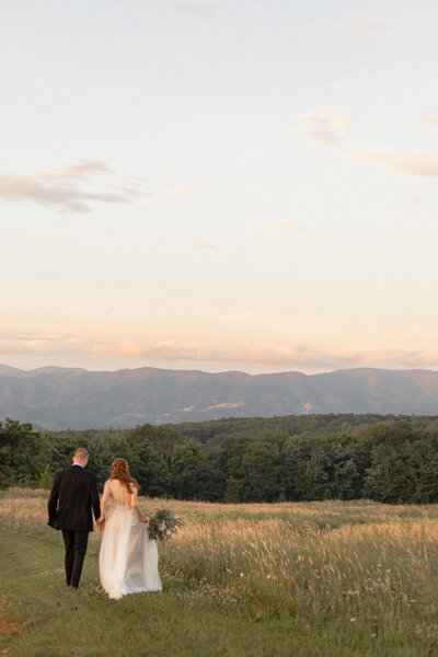 photo of bride and groom walking after their small wedding in asheville