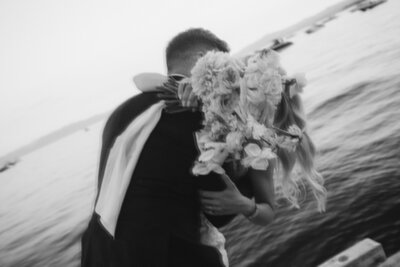 Bride and Groom under pearl veil bridals portraits during sunset on beach in Lake Tahoe