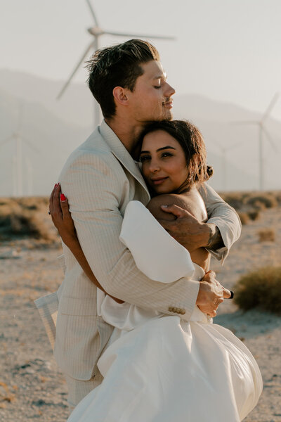 bride and groom hugging pose
