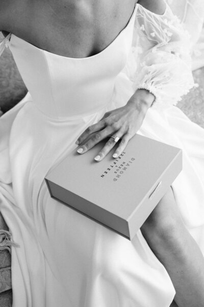 Wedding dress hanging in front of window