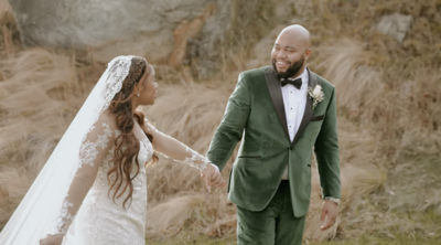 Bride and Groom are walking together and smiling at eachother