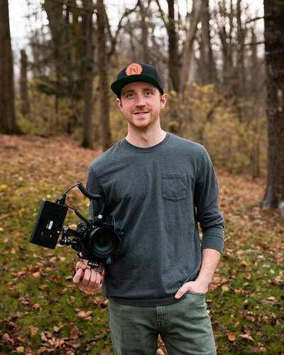 Alex holding a video camera
