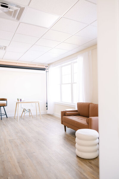 brunnete woman wearing cozy sweater smiling for camera