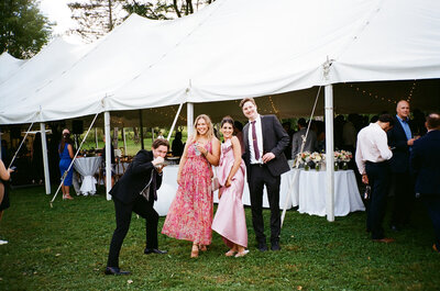 wedding guests pose for photography