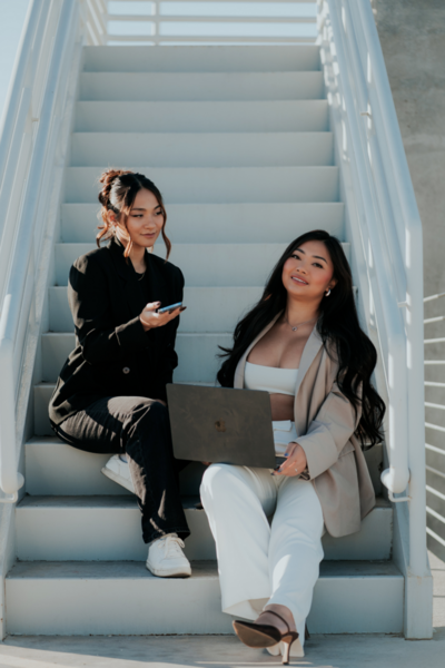 Kemotion business owners collaborating at their desks, designing client websites with expertise in website design for service-based businesses.