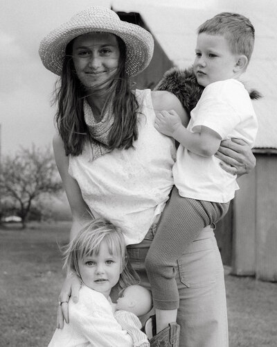 Father hugging the bride with visible emotion, capturing an intimate, heartfelt moment in authentic, documentary-style wedding photography.