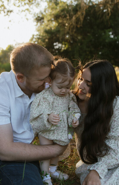 family of 3 snuggling