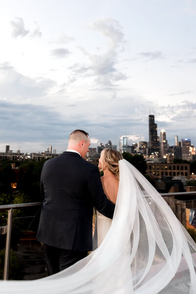 Downtown Chicago roof top nighttime portrait of Bride and Groom at Lacuna Lofts