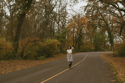 girl sitting next to brick wall in newberg, oregon