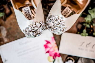 gorgeous bridal details outside of cleveland wedding with shoes and invitation set