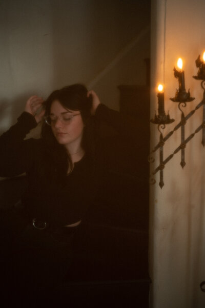 Photographer on stairs with their hands in their hair