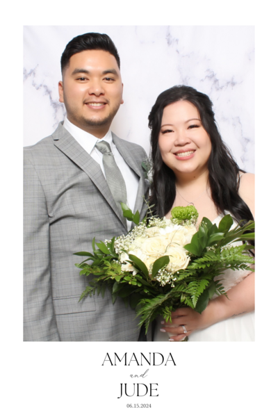 Couple pose together at their wedding reception with flowers