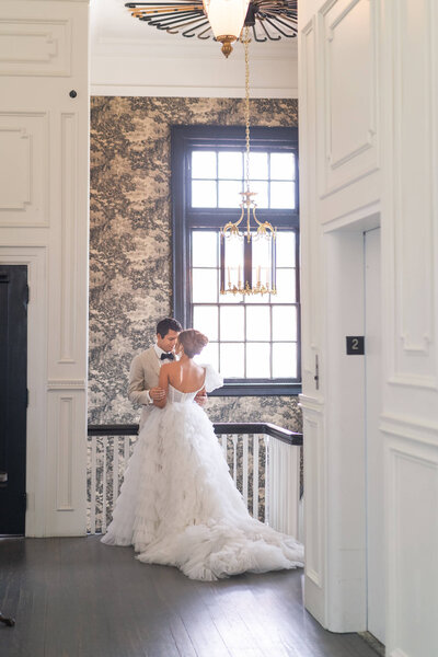 bride and groom kiss on their wedding day at The Mason in Dallas Texas by Swish and Click Photography