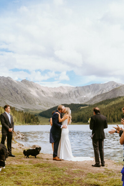 Bride and groom read thank you letter to family at Maroon Bells elopement in Colorado