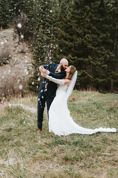 Bride & Groom popping Champagne