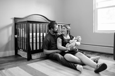 Black&White Parents staring at each other while Mom holds baby | Newborn Photography