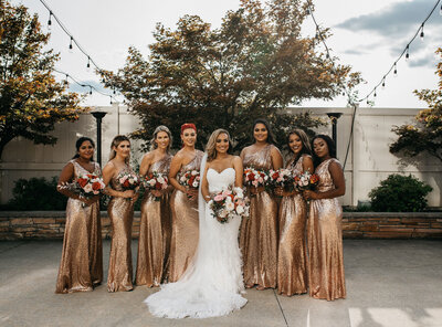 bride and bridesmaids smiling