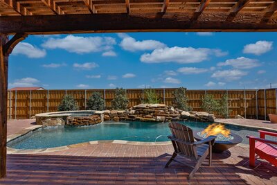 Home for sale in Krum Texas with inground pool and waterfall
