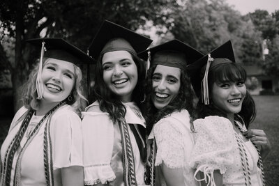 Smiling friends on graduation day