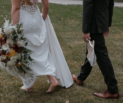 Bride and groom laughing close together  taken by fargo wedding photographer kiella lawrence