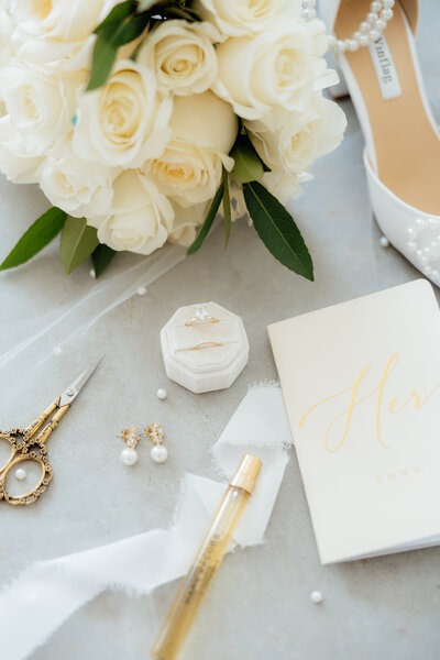 Wedding rings in a ring box with earrings.