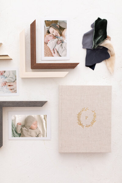 Flatlay photo of luxury frames and albums offered by Savannah FamilyPhotographer Courtney Cronin