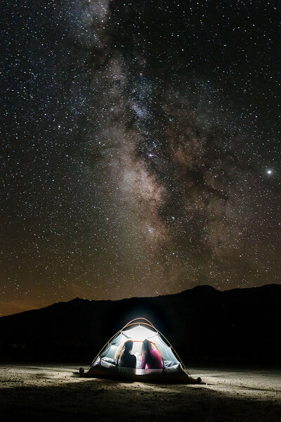 couple in tent under the stars