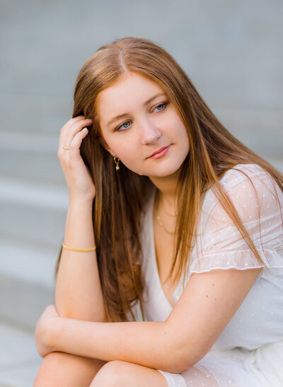 A girl taking her senior portrait in downtown Columbia, South Carolina