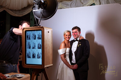 A person going through the photos from the photo booth